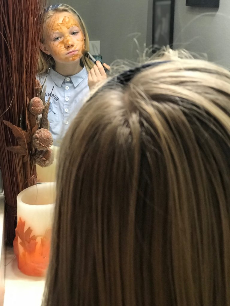 girl applying face mask