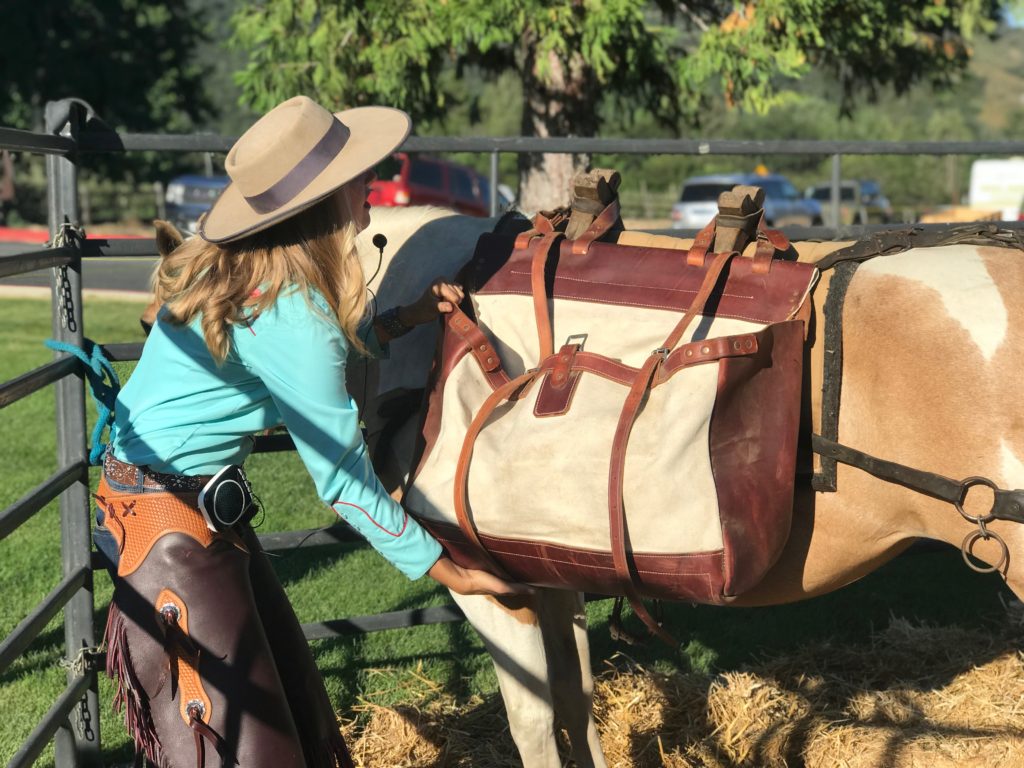 packing a horse at apple cider, cowboy coffee, and hard cider at Chuck Wagon Dinner at Riley's Los Rancho Rios