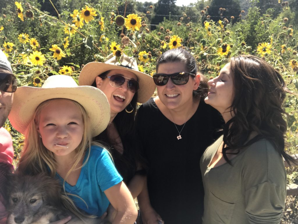 this family taking ridiculous photo in sunflowers