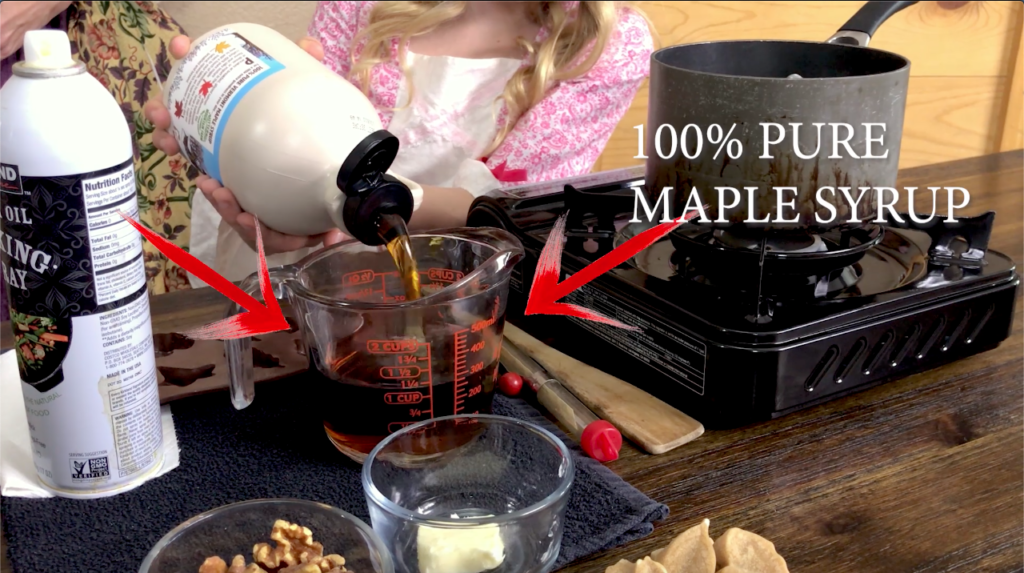 pouring maple syrup to make candy